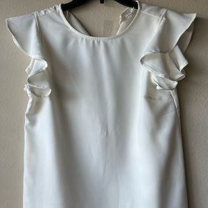 White ruffled blouse